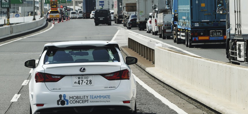 Toyota's automated driving test vehicle enters a highway on-ramp in Tokyo, Tuesday, Oct. 6, 2015.
