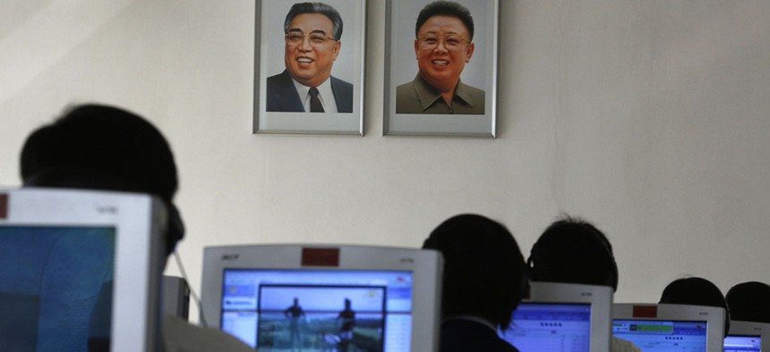 North Korean students use computers near portraits of the country's later leaders Kim Il Sung, left, and his son Kim Jong Il at the Kim Chaek University of Technology in Pyongyang, North Korea.