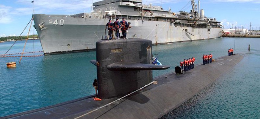 The fast attack submarine USS Salt Lake City prepares to go alongside USS Frank Cable in Apra Harbor, Guam. 