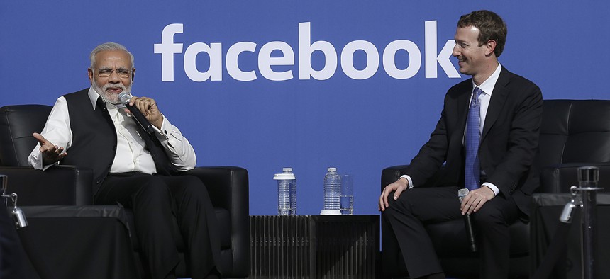 Prime Minister of India Narendra Modi, left, speaks next to Facebook CEO Mark Zuckerberg at Facebook in Menlo Park, Calif., Sunday, Sept. 27, 2015. 
