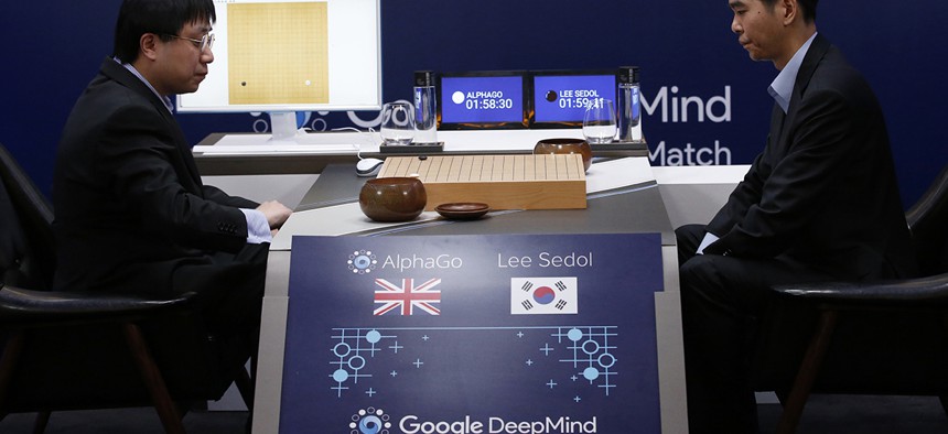 South Korean professional Go player Lee Sedol, right, prepares for his second stone against Google's artificial intelligence program, AlphaGo.