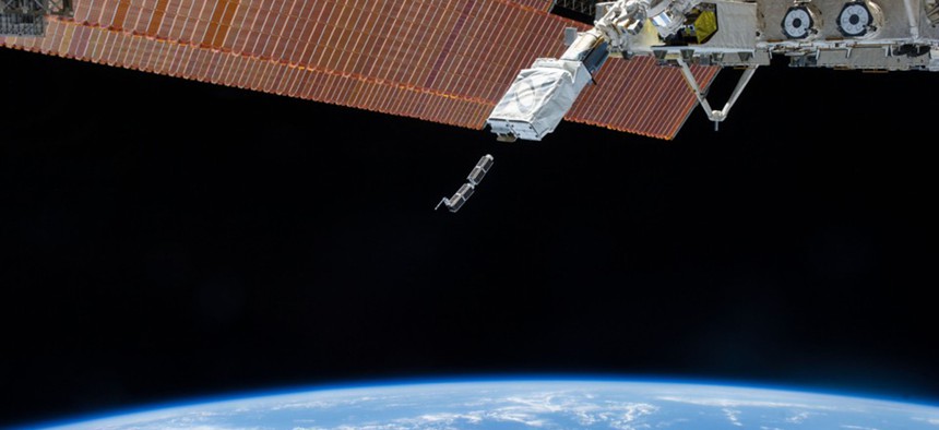 The International Space Station releases early Planet Labs satellites in February 2014.