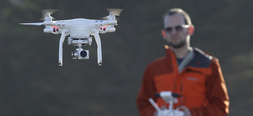 Trent Lukaczyk, an unmanned aerial vehicle engineer who builds and flies drones to monitor changes in the ocean environment, controls a DJI Phantom 3 Advanced drone to take photos and videos over the coastline in Pacifica, Calif. 