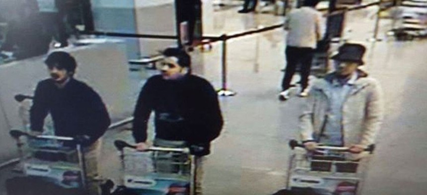 In this image provided by the Belgian Federal Police in Brussels on Tuesday, March 22, 2016, three men who are suspected of taking part in the attacks at Belgium's Zaventem Airport and are being sought by police. 
