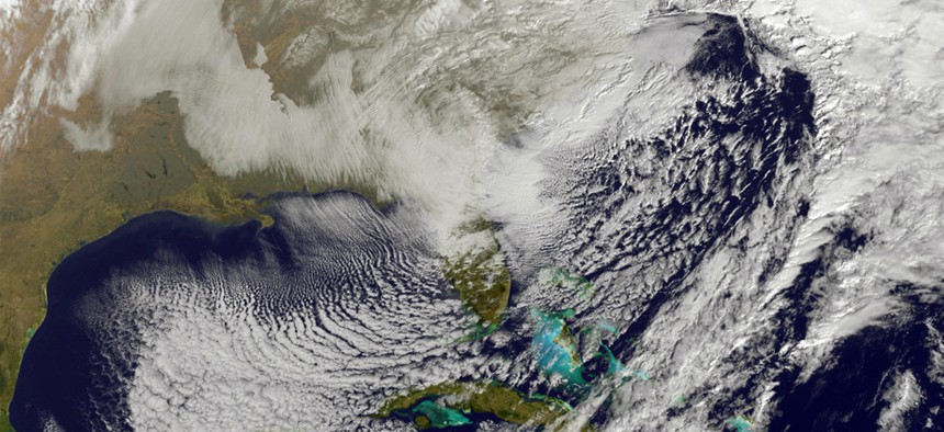 This image taken by NOAA's GOES-East satellite on Saturday, Jan. 23, 2016, at 9:37 a.m. EST, shows a large winter snowstorm over the East Coast of the United States.