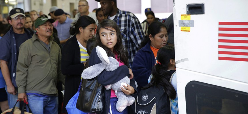 Immigrants from El Salvador and Guatemala who entered the country illegally board a bus after they were released from a family detention center in San Antonio.