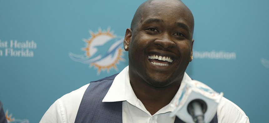 Former Mississippi offensive lineman and top Miami Dolphins draft pick Laremy Tunsil, smiles during a news conference, Friday, April 29, 2016.