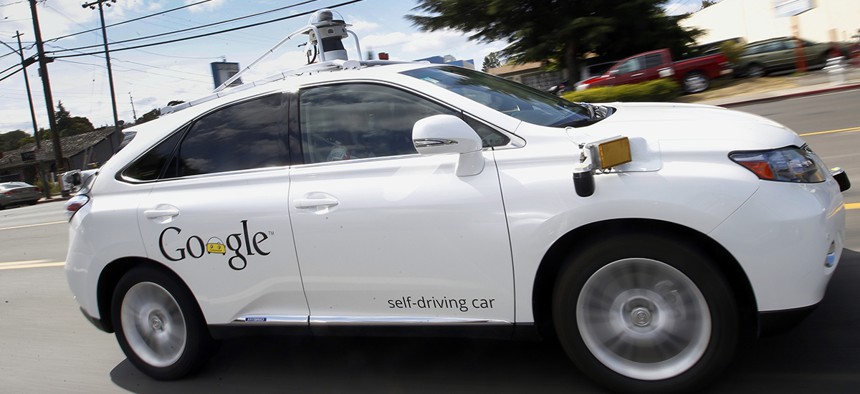 Google's self-driving Lexus drives along a street during a demonstration at Google campus in Mountain View, Calif.