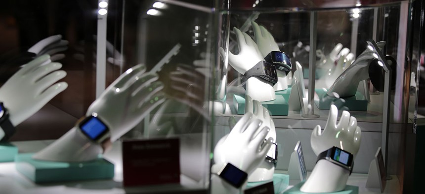 Smartwatches based on Qualcomm chipsets are on display at the Qualcomm booth at the 2015 International Consumer Electronics Show.