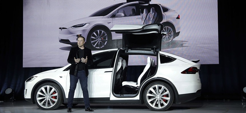 Elon Musk, CEO of Tesla Motors Inc., introduces the Model X car at the company's headquarters Tuesday, Sept. 29, 2015, in Fremont, Calif.