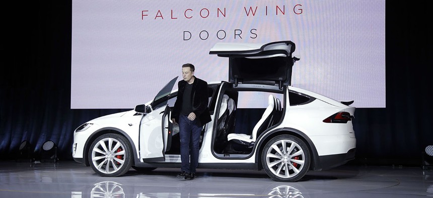Elon Musk, CEO of Tesla Motors Inc., introduces the Model X car at the company's headquarters Tuesday, Sept. 29, 2015.