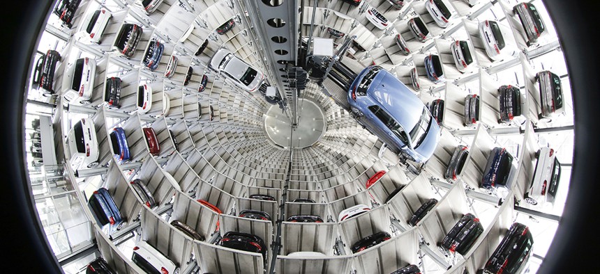 Volkswagen cars are presented to media inside a delivery tower prior to the company's annual press conference in Wolfsburg, Germany, Thursday, April 28, 2016.