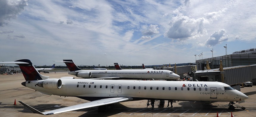 Delta Air Lines planes are seen on the tarmac at Washington's Ronald Reagan Washington National Airport, Monday, Aug. 8, 2016. 