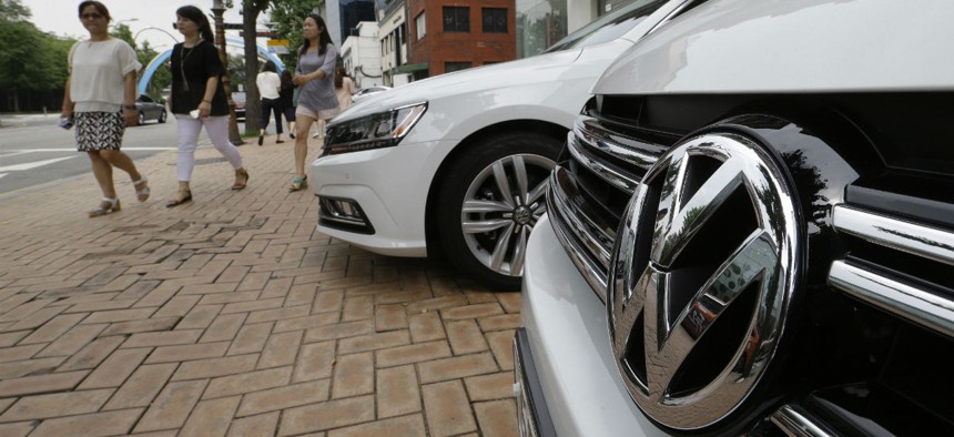 The Volkswagen emblem is seen on a vehicle in front of a dealership in Seoul, South Korea, Tuesday, Aug. 2, 2016.