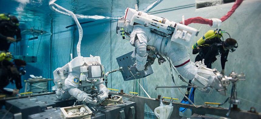 NASA astronaut Terry Virts simulates extravehicular activity in the Johnson Space Center's Neutral Buoyancy Laboratory.