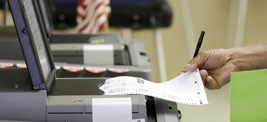 A voter casts his primary vote in Hialeah, Fla.