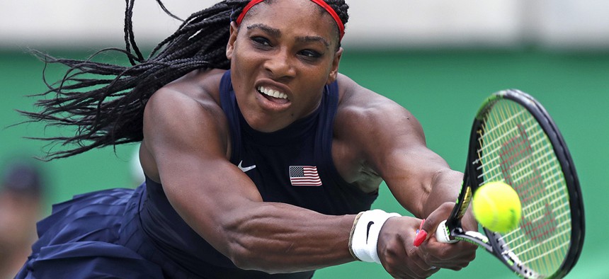 Serena Williams, of the United States, reaches for a return against Daria Gavrilova, of Australia, at the 2016 Summer Olympics in Rio de Janeiro, Brazil.