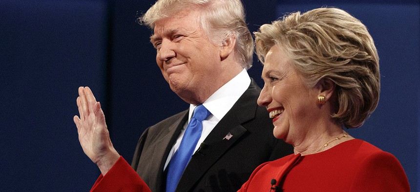 Republican presidential candidate Donald Trump, left, stands with Democratic presidential candidate Hillary Clinton at the first presidential debate at Hofstra University, Monday, Sept. 26, 2016.