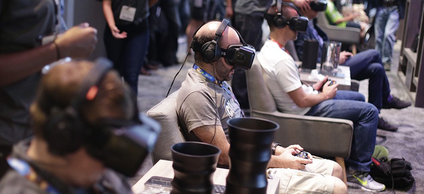 People try out the Oculus Rift virtual reality headsets.