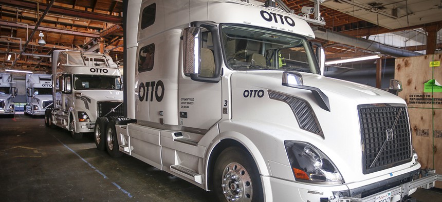 Otto's self-driving, big-rig trucks are lined up during a demonstration at the Otto headquarters on Thursday, Aug. 18, 2016, in San Francisco. 