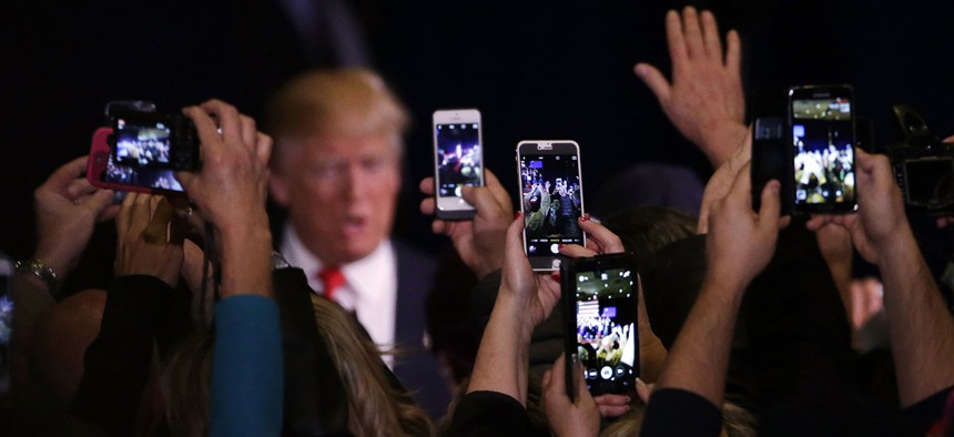 Supporters take cell phone photographs of Republican presidential candidate Donald Trump during a rally Tuesday, Feb. 23, 2016, in Reno, Nev.