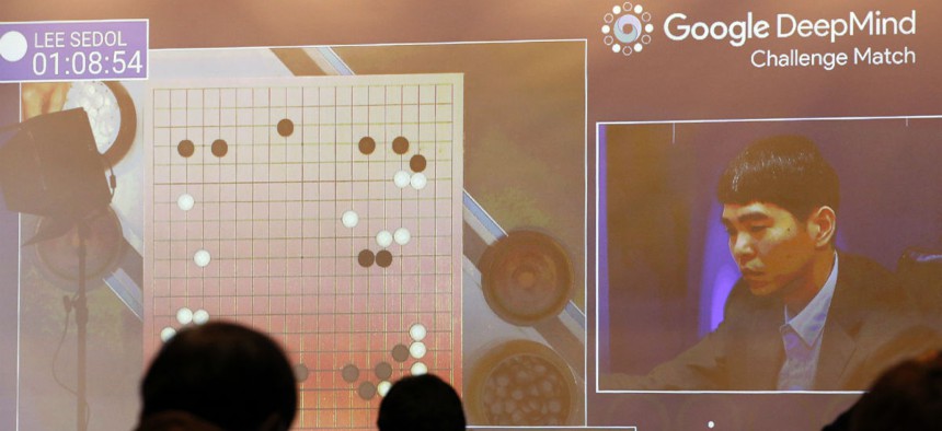 South Korean professional Go player Lee Sedo appears on the screen during the second match of the Google DeepMind Challenge Match against AlphaGo in March 2016.