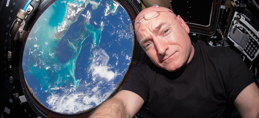  Astronaut Scott Kelly takes a photo of himself inside the Cupola, a special module of the International Space Station which provides a 360-degree viewing of the Earth and the station.