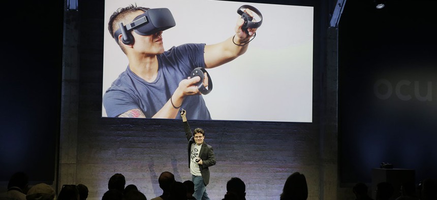 Oculus Founder Palmer Luckey talks about the Rift virtual-reality headset during a news conference Thursday, June 11, 2015, in San Francisco. 