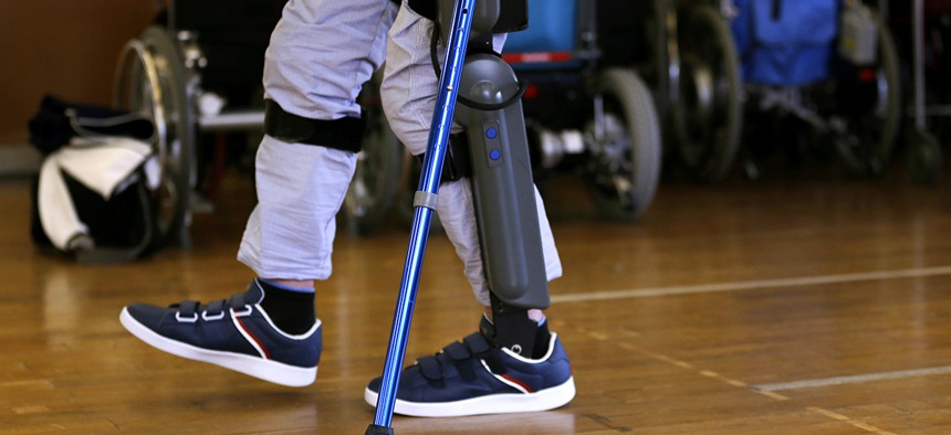Yuichi Imahata walks using a robotic exoskeleton called ReWalk at Kanagawa Rehabilitation Center in Atgugi, west of Tokyo.