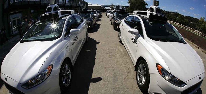 A group of self driving Uber vehicles position themselves to take journalists on rides during a media preview at Uber's Advanced Technologies Center in Pittsburgh, Monday, Sept. 12, 2016. 