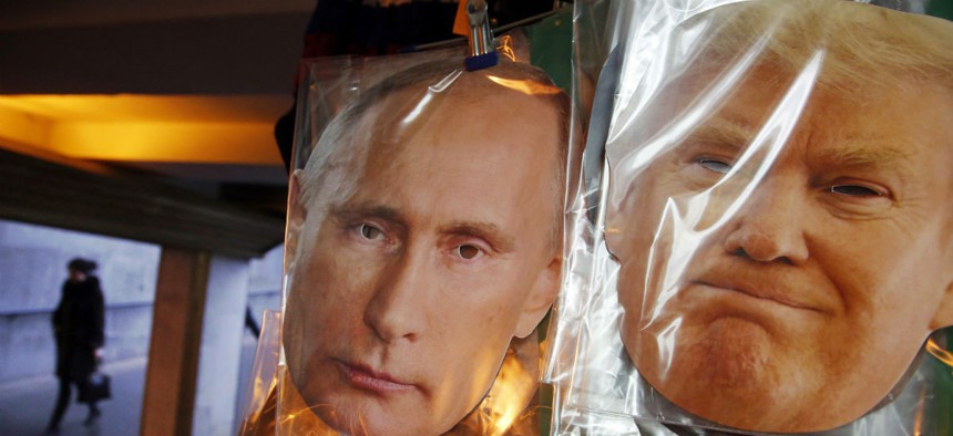 Face masks depicting Russian President Vladimir Putin and U.S. President-elect Donald Trump hang for sale at a souvenir street shop in St.Petersburg.