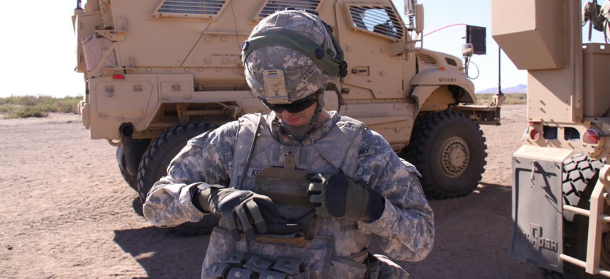 A solider demonstrates a Nett Warrior device.