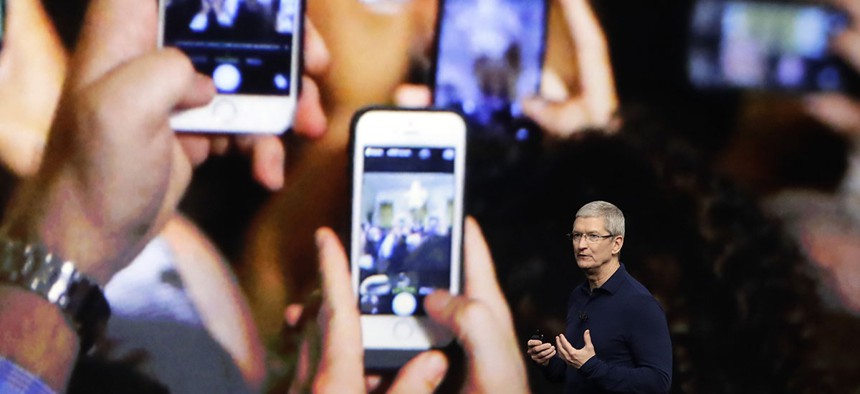 Apple CEO Tim Cook announces the new iPhone 7 during an event to announce new products, in San Francisco.