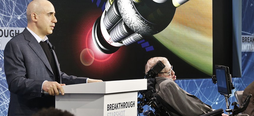Internet investor and science philanthropist Yuri Milner, left, and renowned cosmologist Stephen Hawking, right, discuss the new Breakthrough Initiative focusing on space exploration and the search for life in the universe.