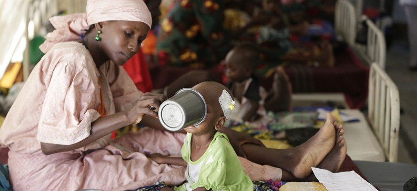 A mother feeds her malnourished child at a feeding centre run by Doctors Without Borders in Maiduguri, Nigeria.