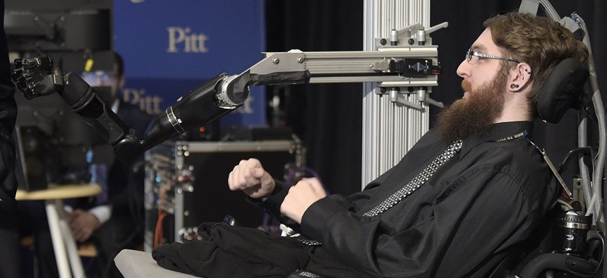 Nathan Copeland, a participant in a study that allows him to perceive touch through a robotic arm