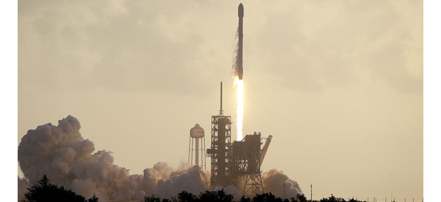 A Falcon 9 SpaceX rocket carrying a classified satellite for the National Reconnaissance Office lifts off from pad 39A at the Kennedy Space Center in Cape Canaveral, Fla.