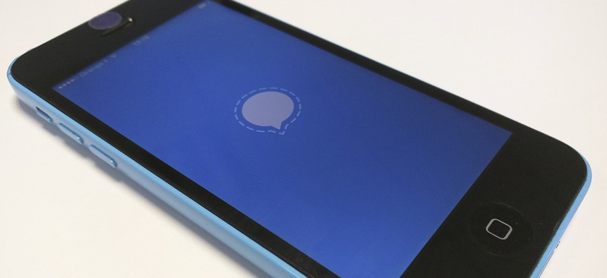 The Signal encrypted messaging app loading on a smartphone.
