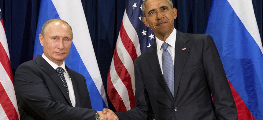 U.S. President Barack Obama, right, and Russia's President President Vladimir Putin pose for members of the media before a bilateral meeting at the United Nations headquarters in 2015.