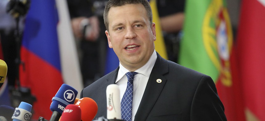 Estonian Prime Minister Juri Ratas speaks with the media as he arrives for an EU summit at the Europa building in Brussels on Thursday, June 22, 2017.