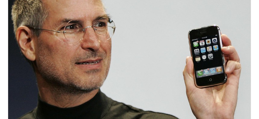 Then-Apple CEO Steve Jobs demonstrates the new iPhone during his keynote address at MacWorld Conference in 2007.