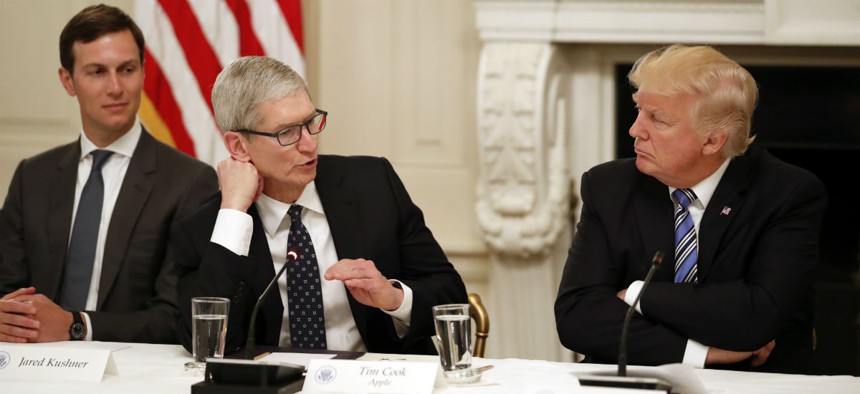 Apple's Time Cook speaks to President Donald Trump during an American Technology Council meeting.