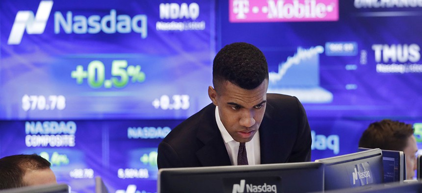 Brad Smith monitors stock prices at the Nasdaq MarketSite, Tuesday, April 25, 2017, in New York.
