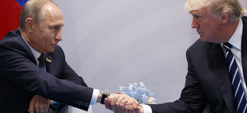 President Donald Trump shakes hands with Russian President Vladimir Putin at the G20 Summit, Friday, July 7, 2017.