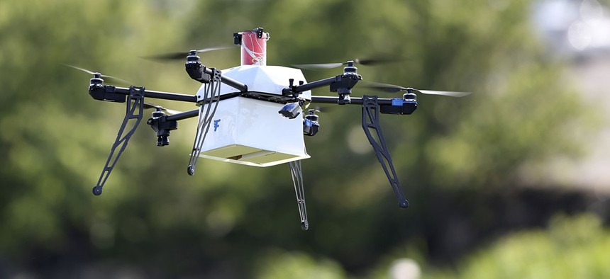 A drone aircraft with a payload of simulated blood flies during a ship-to-shore delivery simulation in Lower Township, N.J. 