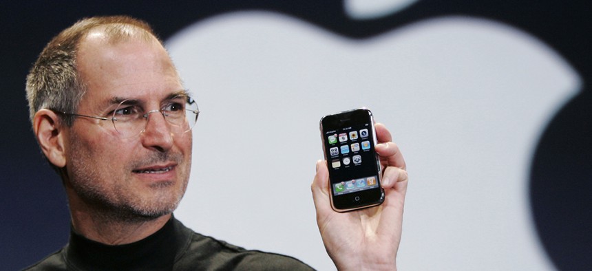 Apple CEO Steve Jobs holds up an Apple iPhone at the MacWorld Conference in San Francisco, in this Jan. 9, 2007.