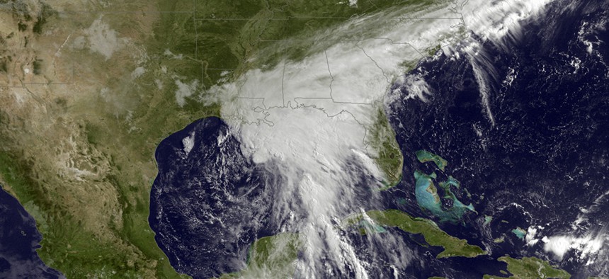 This satellite image taken Tuesday, June 20, 2017, and released by the National Oceanic and Atmospheric Administration shows a tropical storm over the Gulf of Mexico approaching the Gulf Coast. 