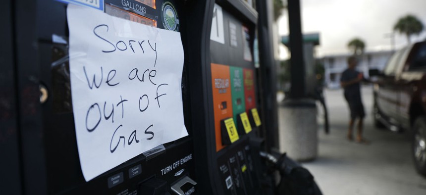 A note is posted to a gas pump after the station ran out of gas ahead of Hurricane Irma in Daytona Beach, Fla., Friday, Sept. 8, 2017.