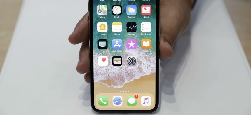 The new iPhone X is displayed in the showroom after the new product announcement at the Steve Jobs Theater on the new Apple campus on Tuesday, Sept. 12, 2017, in Cupertino, Calif.