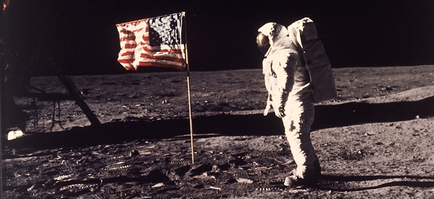 Astronaut Edwin E. "Buzz" Aldrin Jr. poses for a photograph beside the U.S. flag deployed on the moon during the Apollo 11 mission on July 20, 1969.